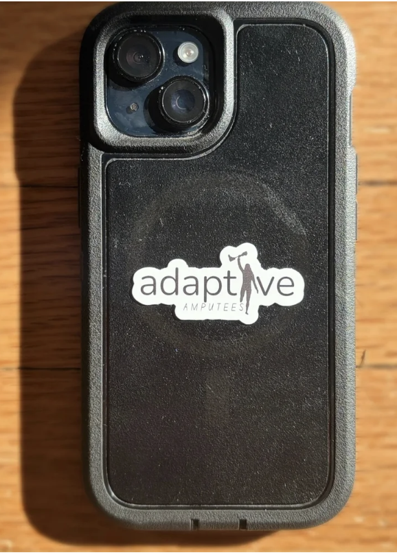 Adaptive Amputees sicker is shown on the back of a mobile phone